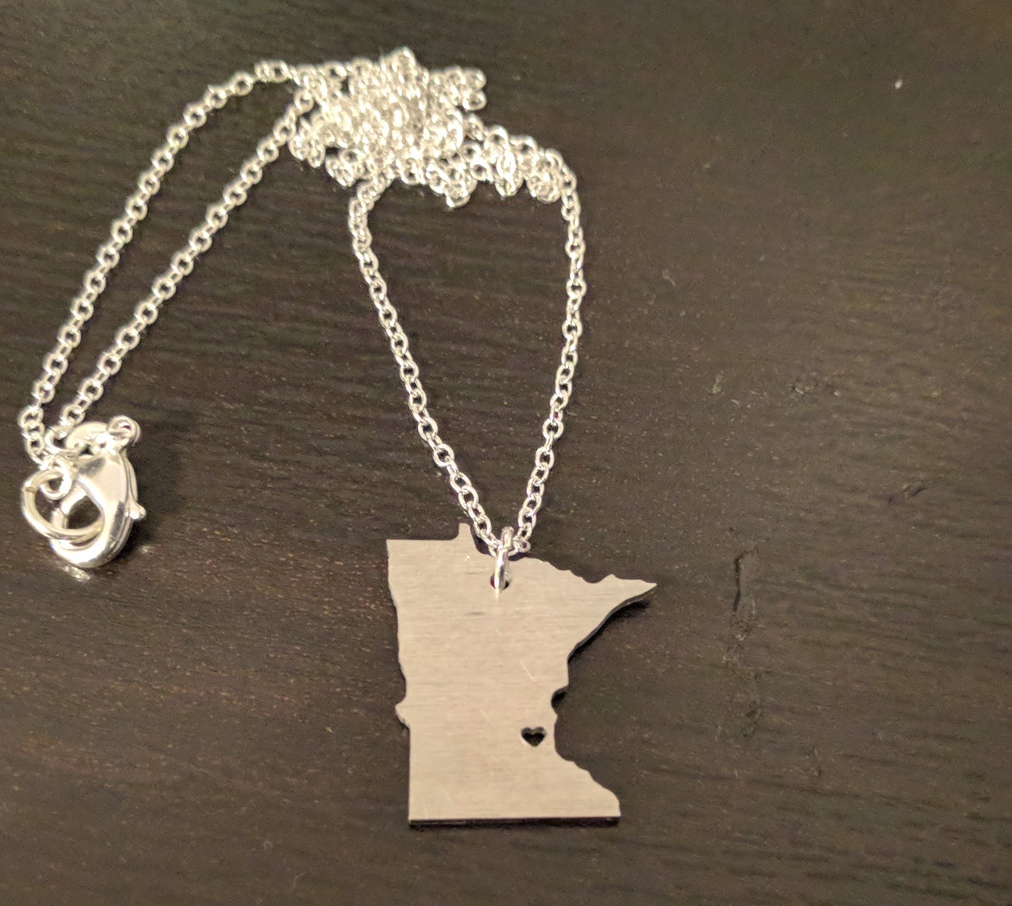 A CNC-milled Minnesota necklace.